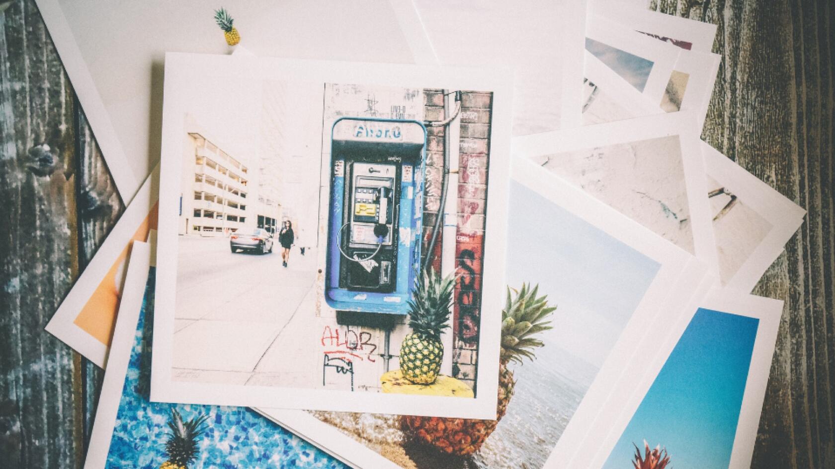 A pile of photographs on a table