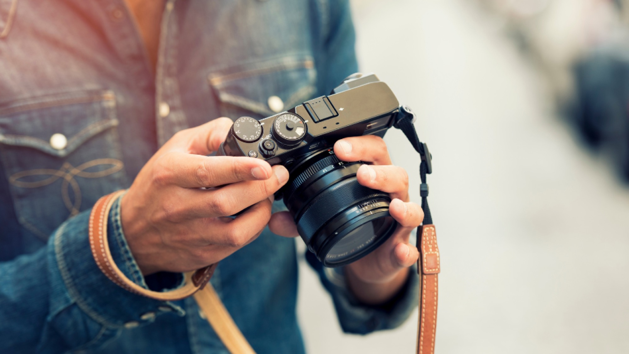 A person is holding a camera in their hand