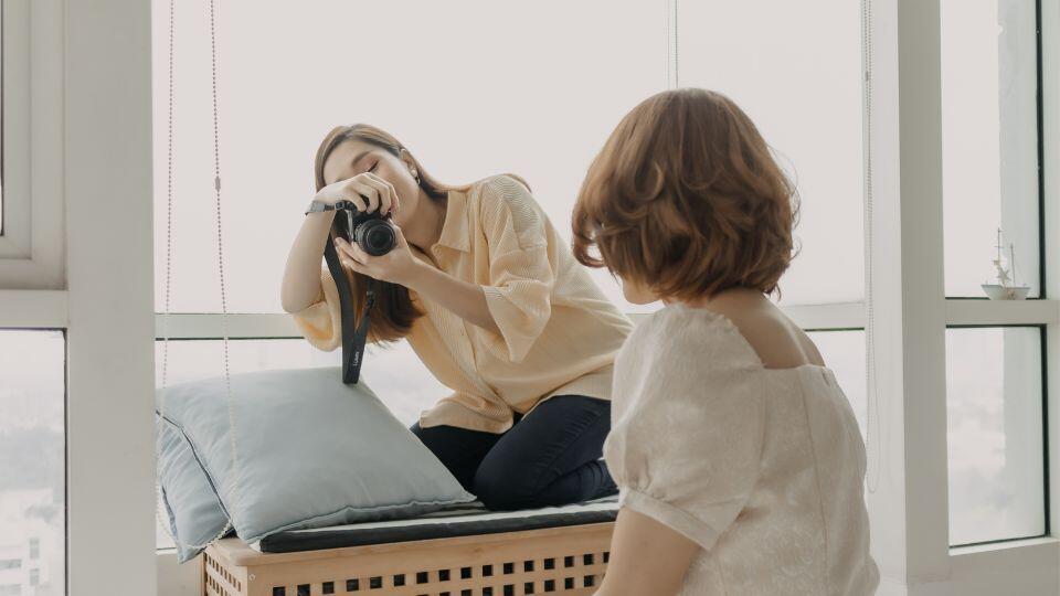 a photographer taking a photo of a client 