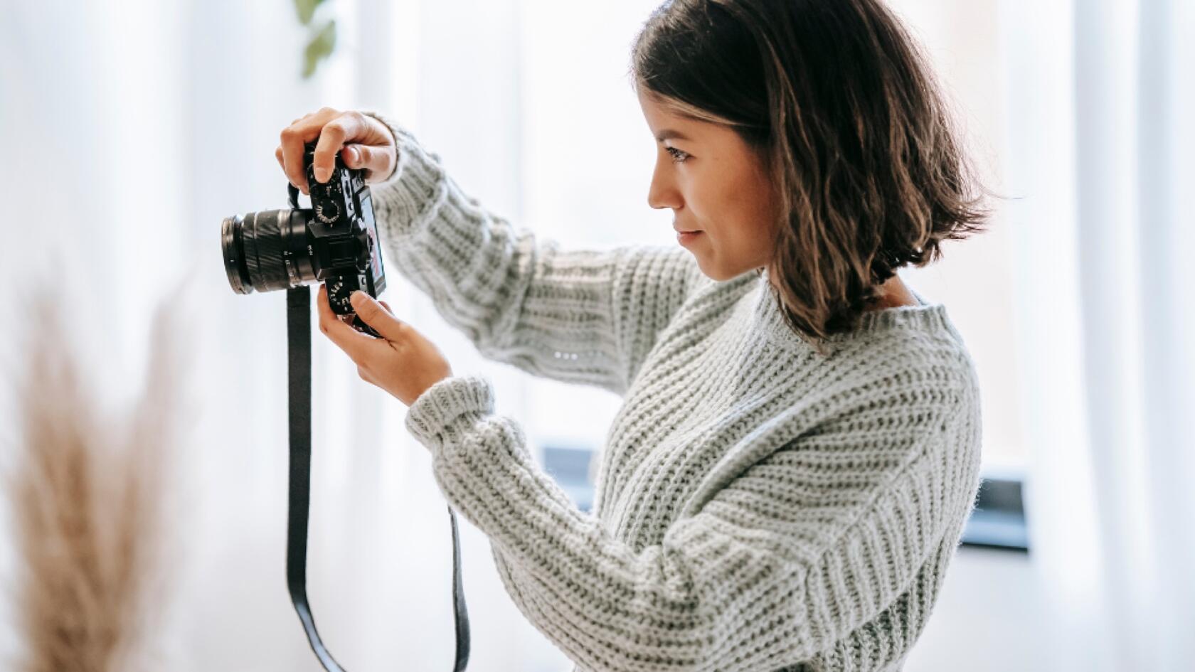 A person taking a photo with a camera