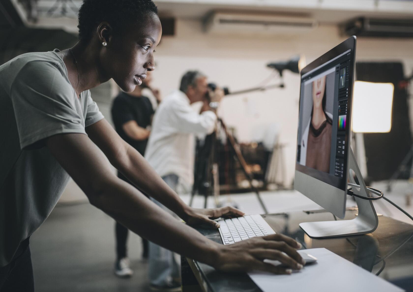 a person checking a photograph on a monitor