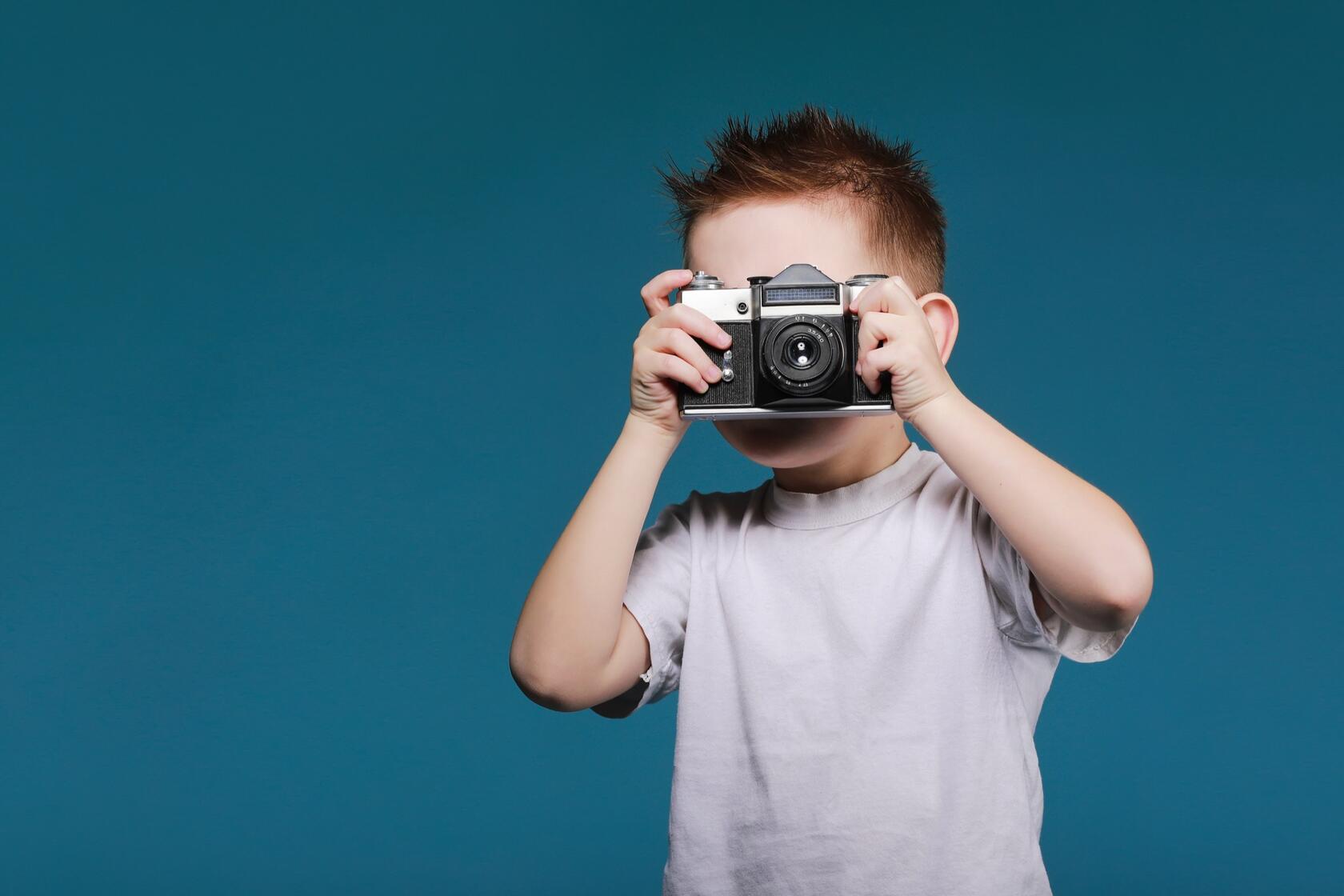 A young kid with a camera